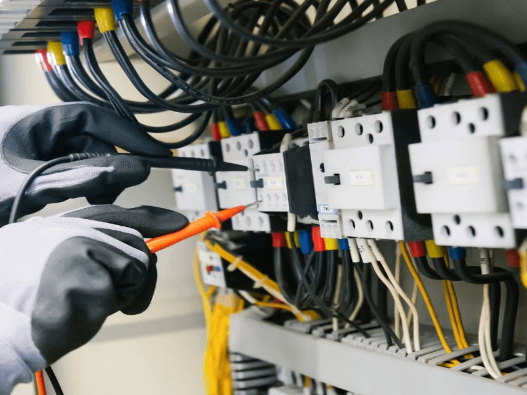 Doncaster electrician testing an electrical consumer unit panel with a multimeter